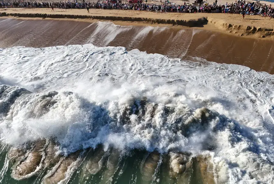 Heavy surf breaking on a sand beach during a winter swell on the Orange County coast